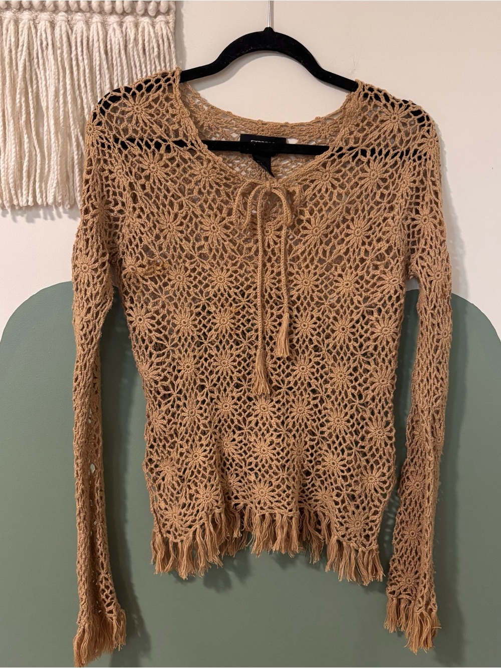 Express tan crochet sweater with floral pattern and tassels